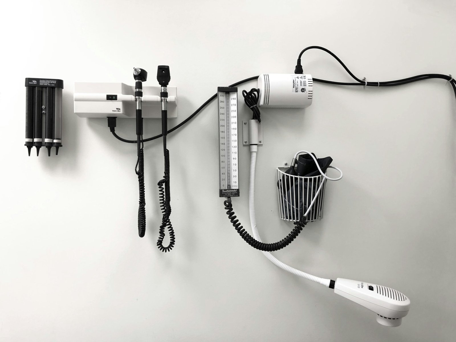 A Hair Dryer And A Hairdryer On A Wall