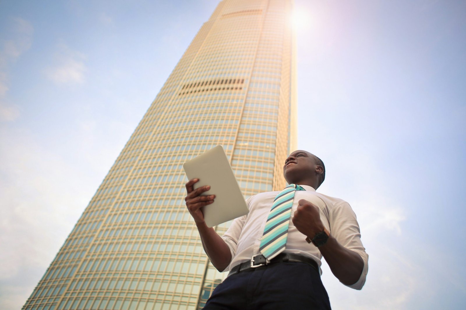 Man Standing Near High-Rise Building