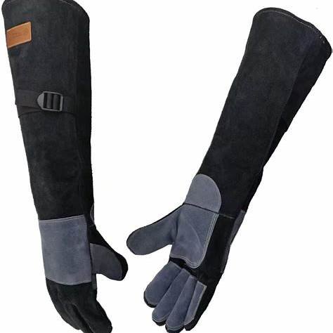 Grooming Gloves for Dogs. Extreme Protection: Made from 1.2mm thick natural cowhide leather, offering excellent bite and scratch resistance. Extended Length: 23.6 inches long to protect hands and forearms. Durable Construction: Reinforced double leather stitching and high-strength sewing for enhanced durability. Versatile Use: Suitable for handling various animals, including dogs, cats, birds, and reptiles. Comfortable Fit: Designed for ease of use during grooming and handling tasks.